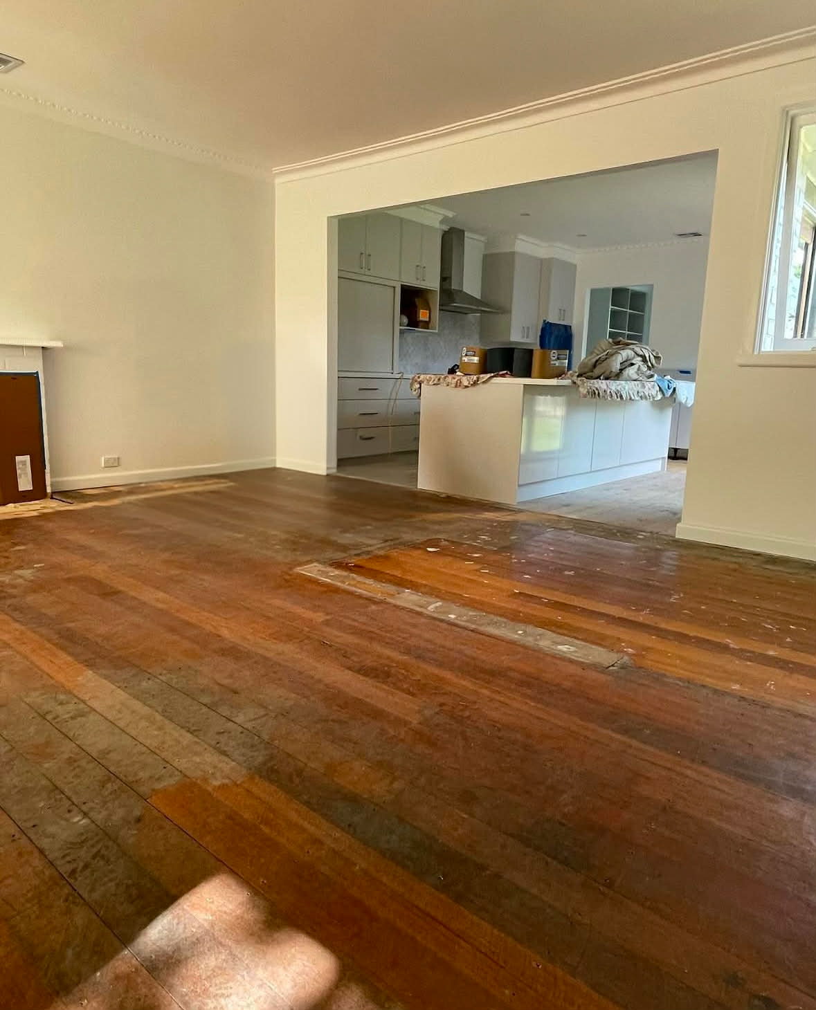 Dark yellow worn kitchen floors before refinishing